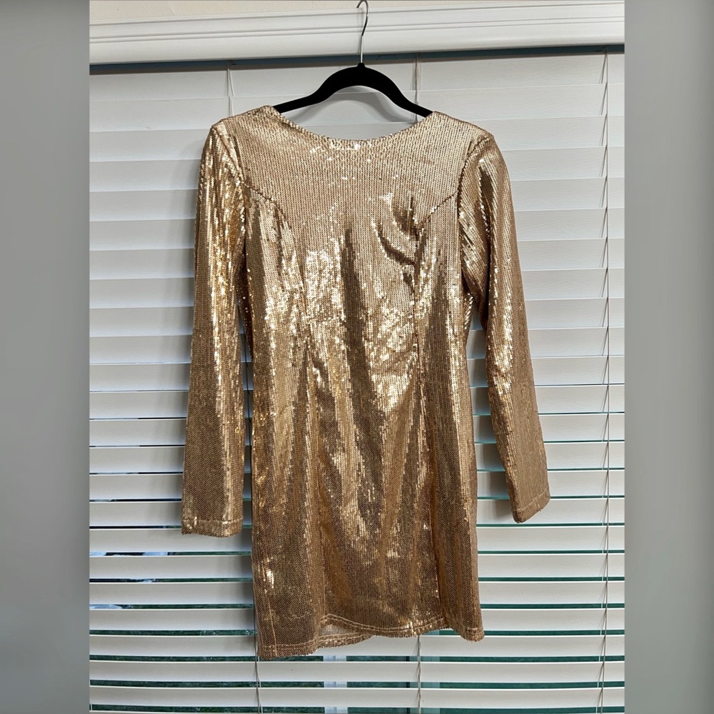 Gold sequence mini cocktail dress.